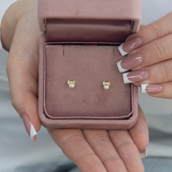 9ct gold freshwater pearl bow stud earrings with sparkling cubic zirconia detail
