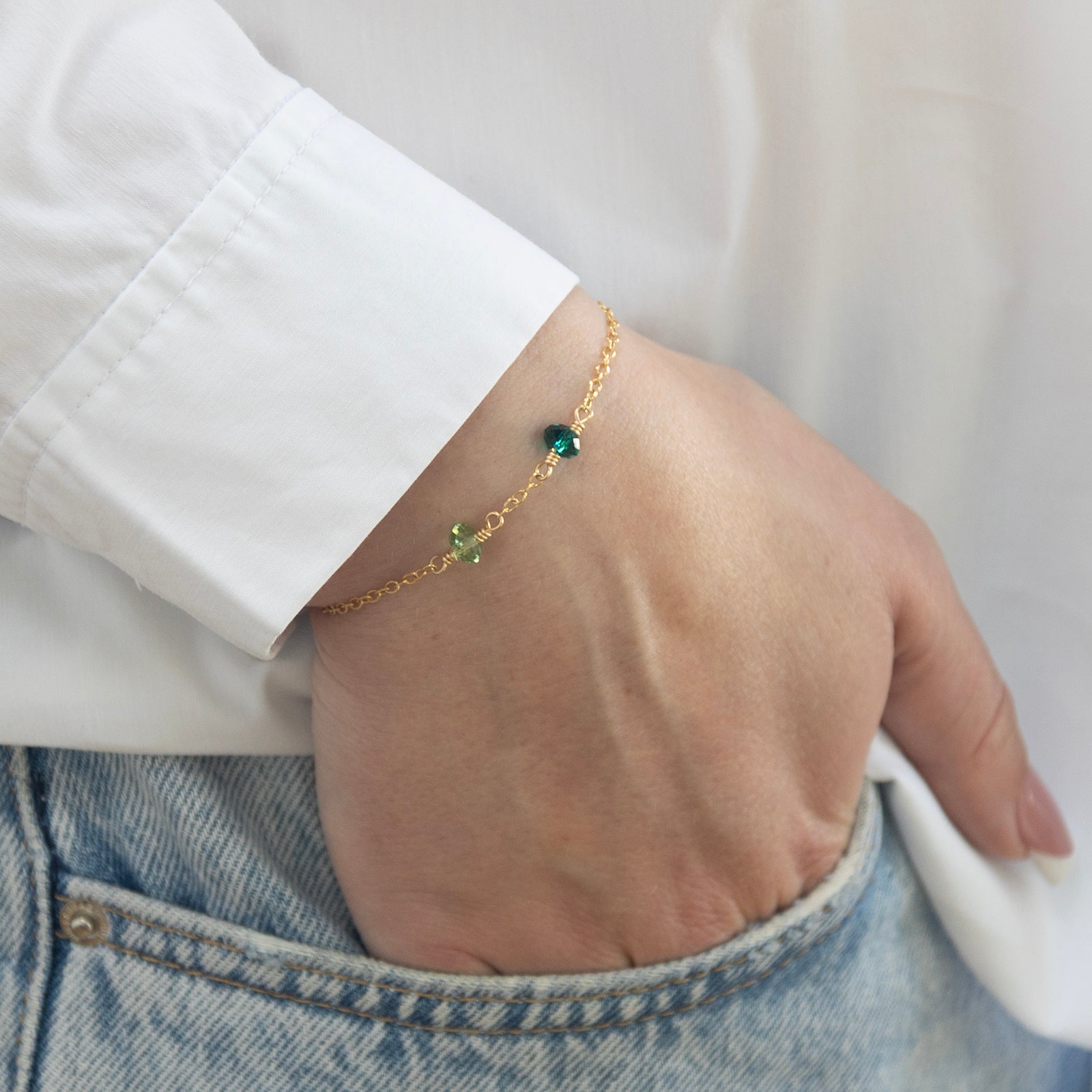 family birthstone bracelet two birthstones worn by a model 