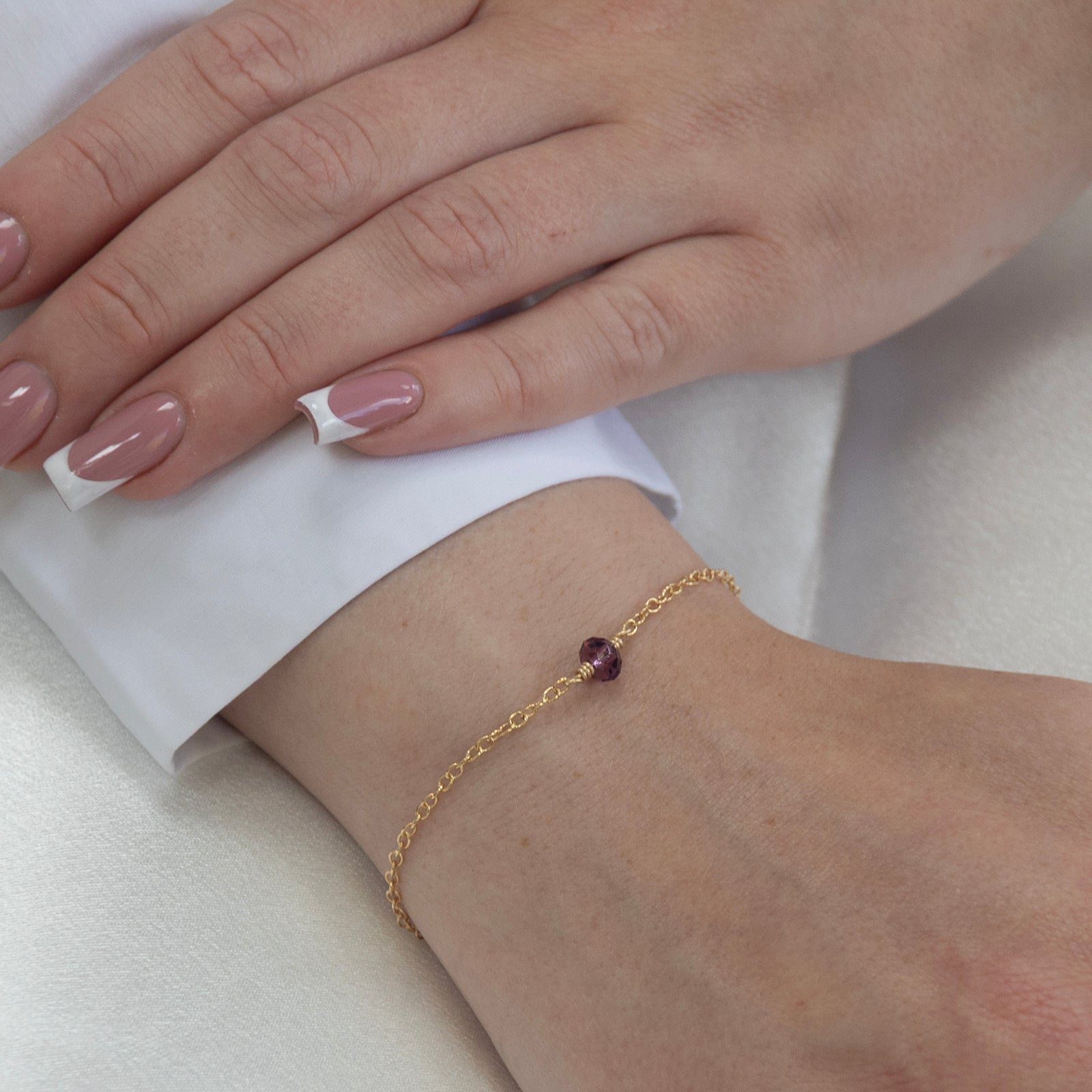 february birthstone bracelet gold on a model 