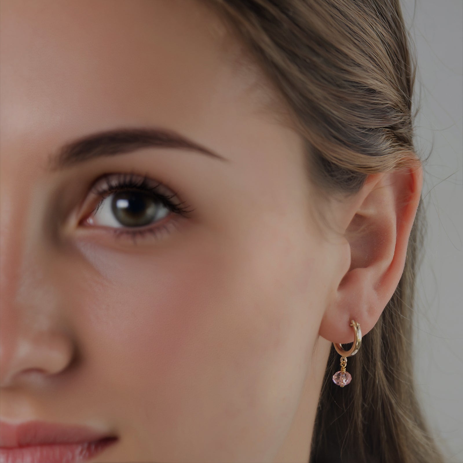 October birthstone earring on a model 