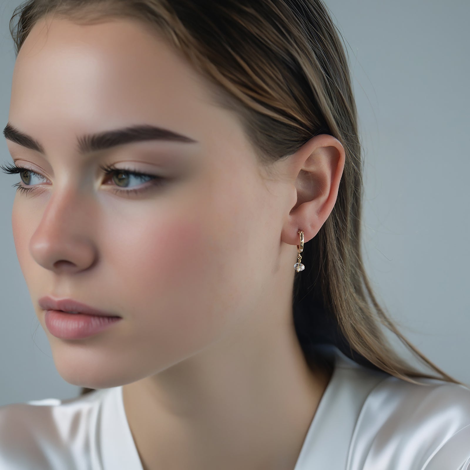 april birthstone earrings on a model in gold 