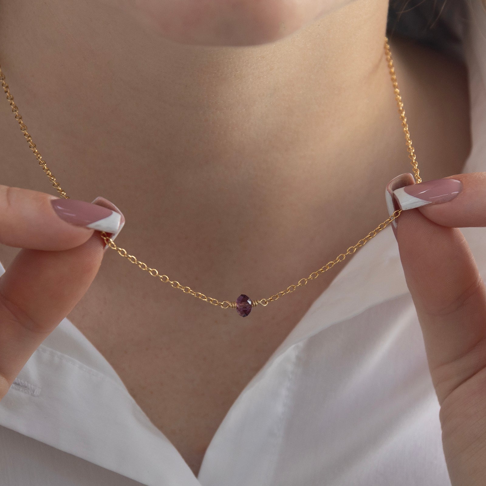 february birthstone necklace gold on a model 