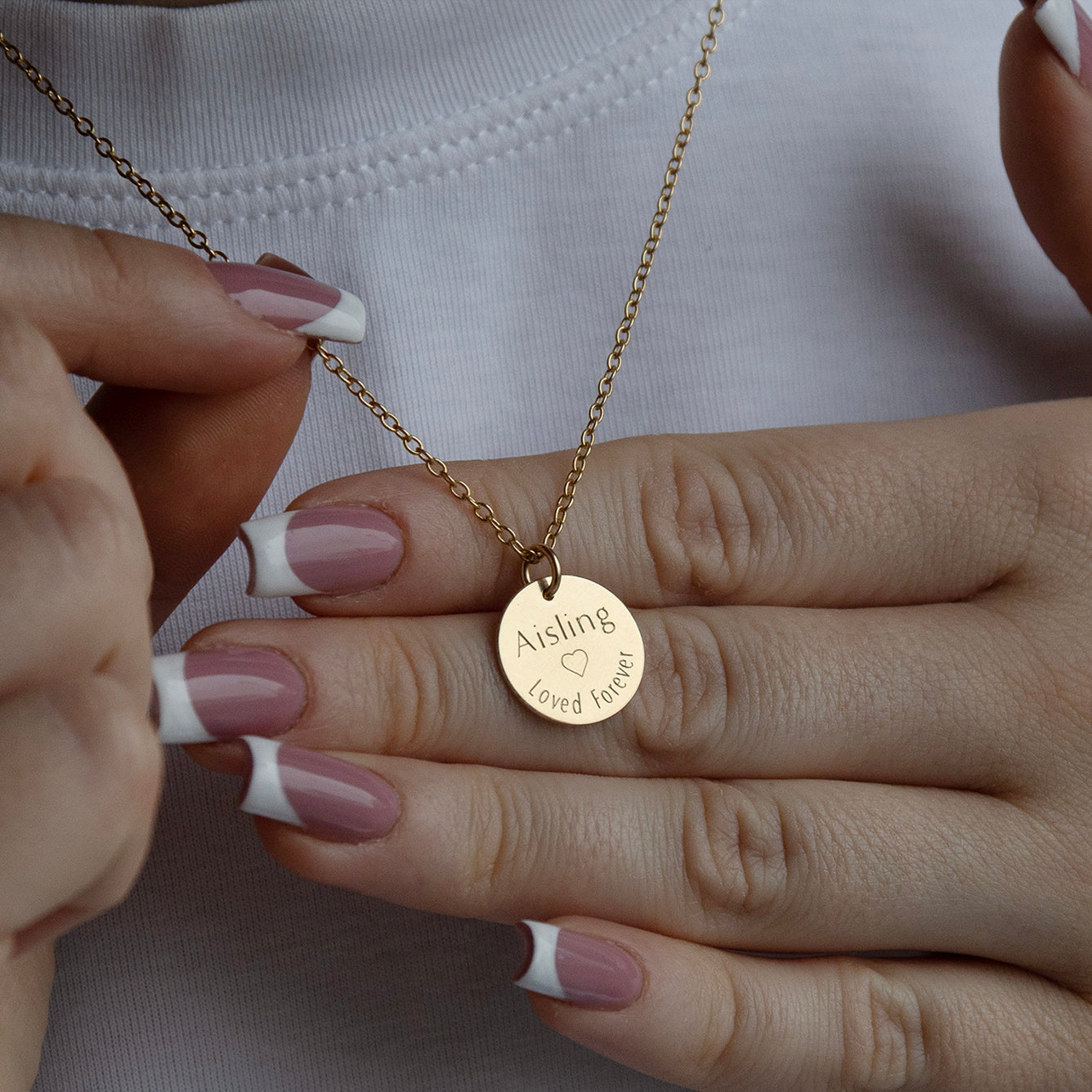 lifestyle image of forget me not memorial necklace from the back on a model 