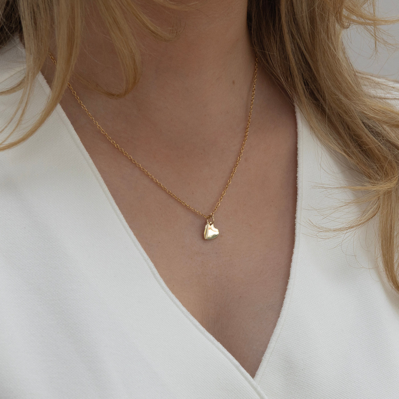 Gold birthstone necklace with heart initial