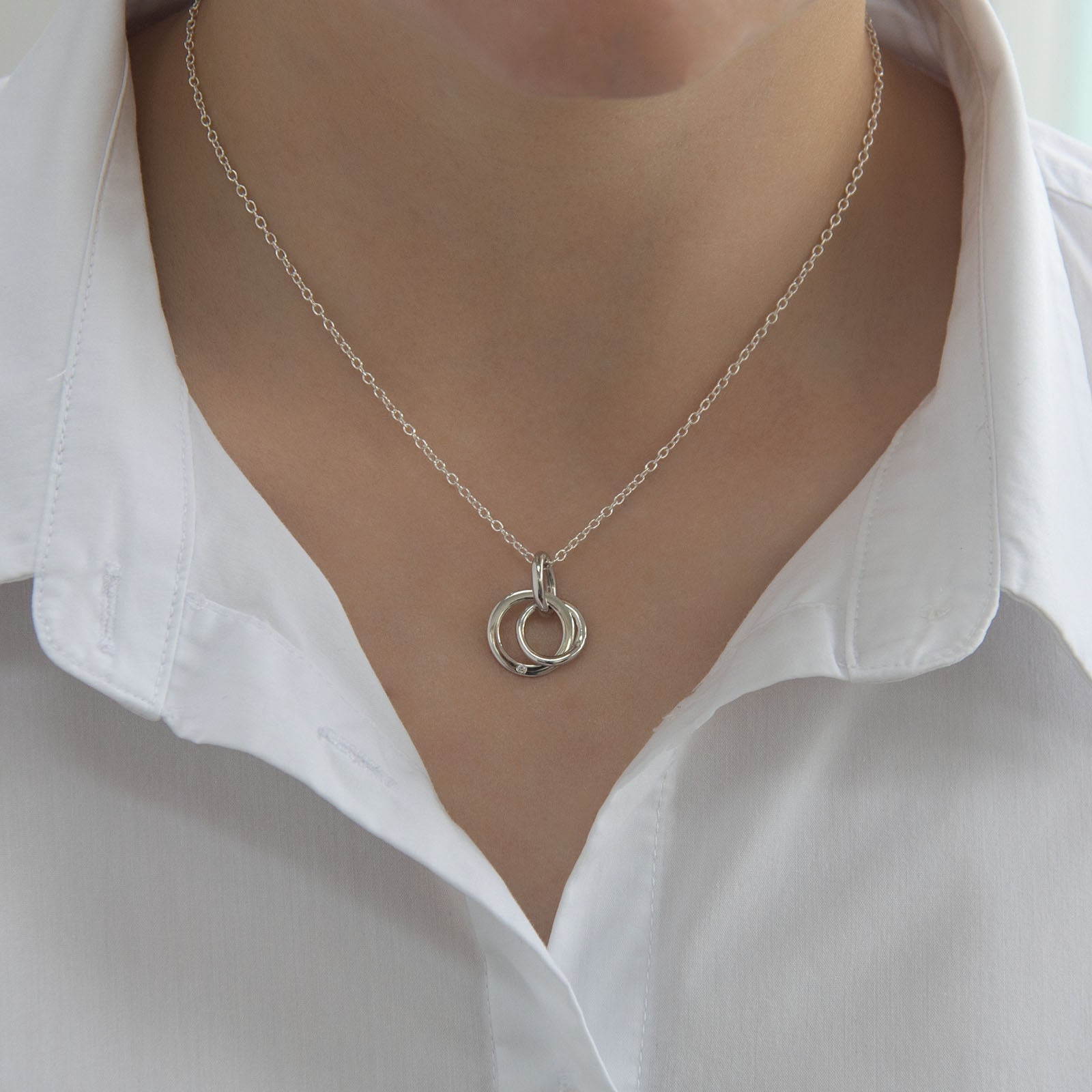 kindred diamond interlocking circles necklace on the neck 