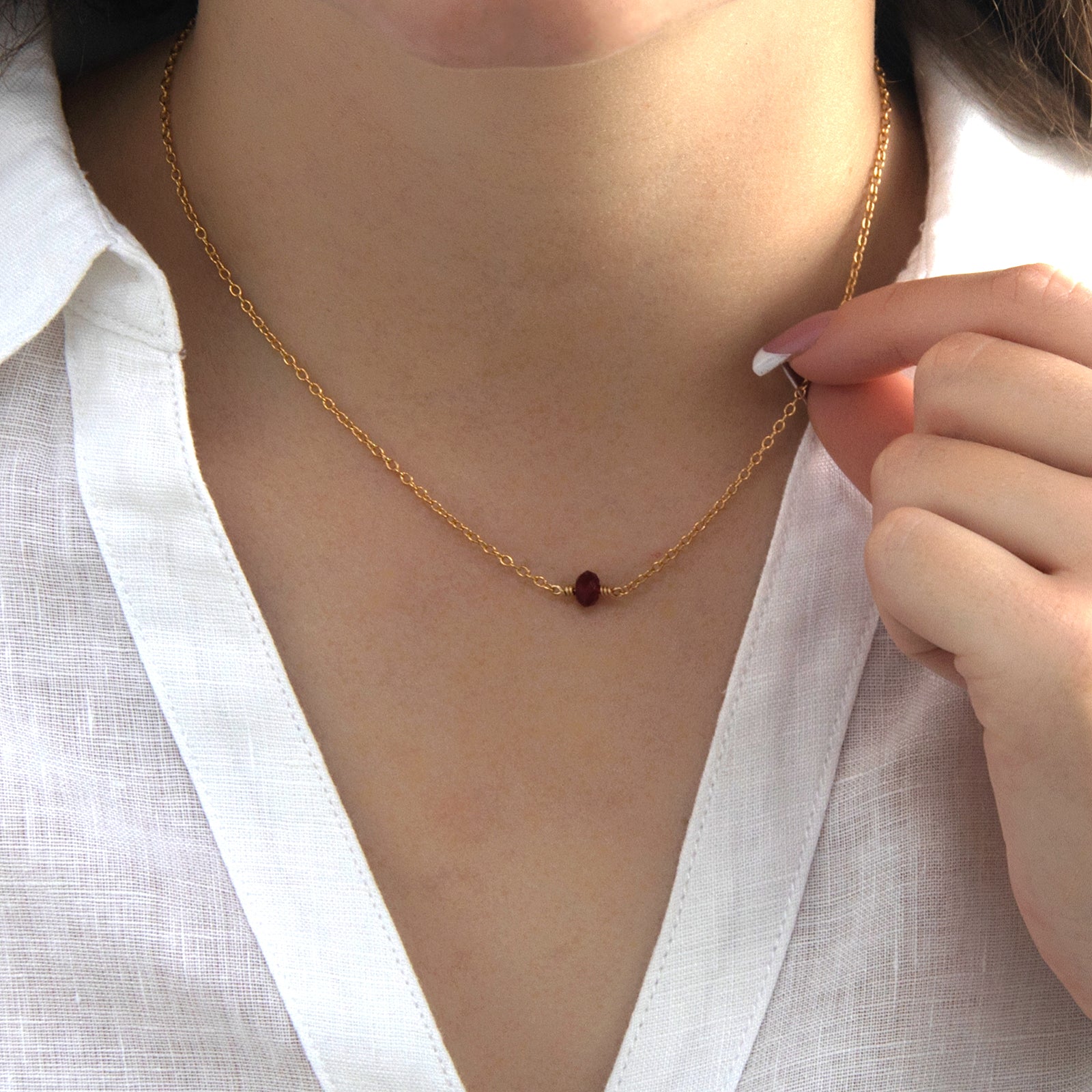 january birthstone necklace gold on a model 