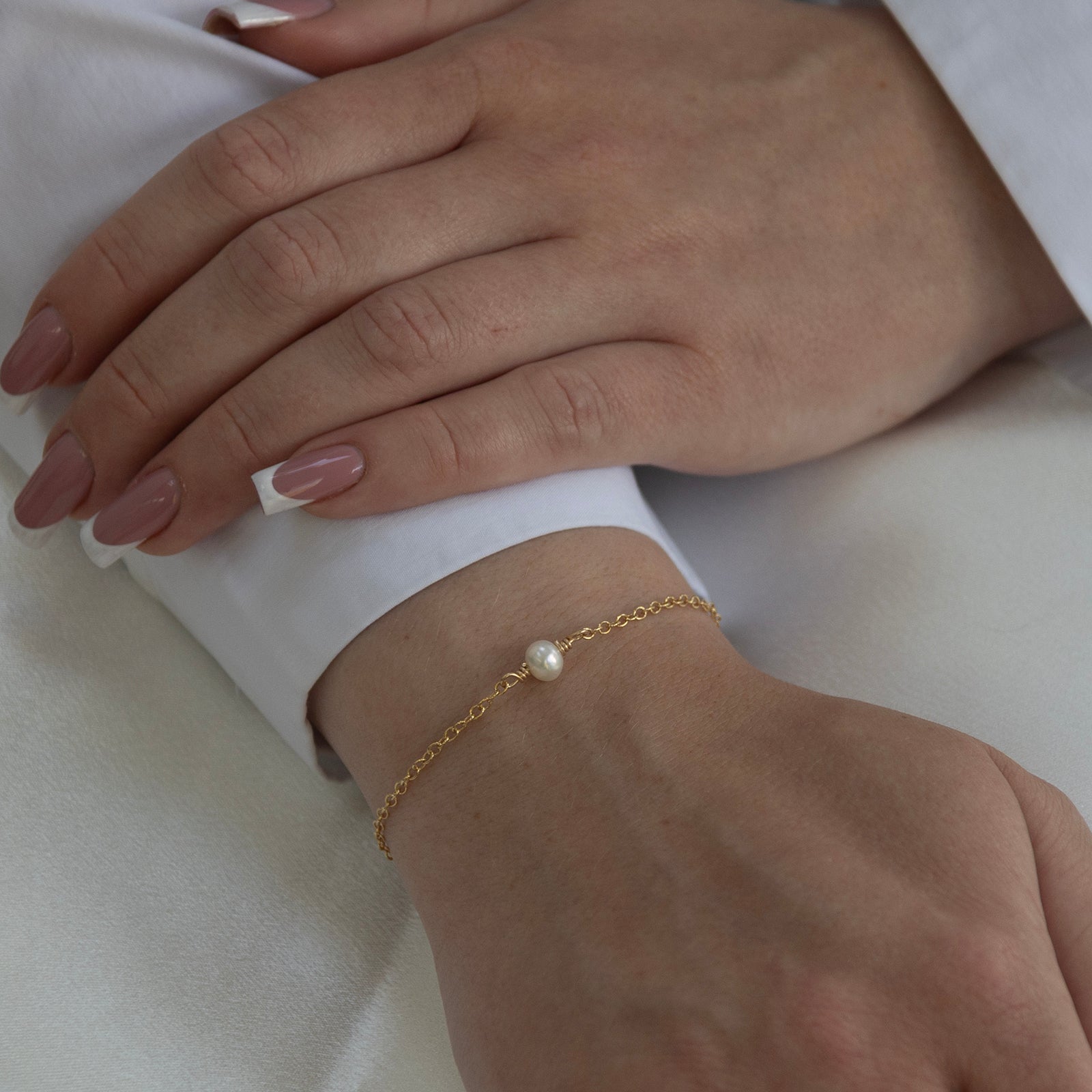 june birthstone bracelet gold on a model 