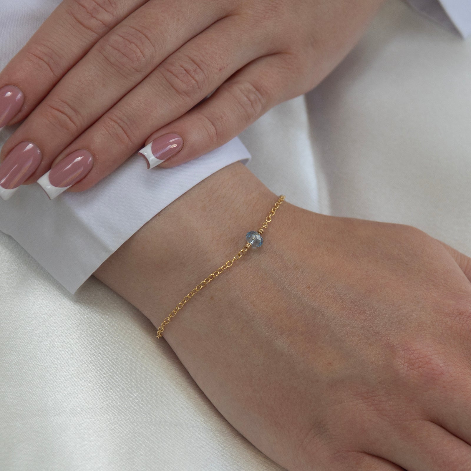 march birthstone bracelet gold on a model 