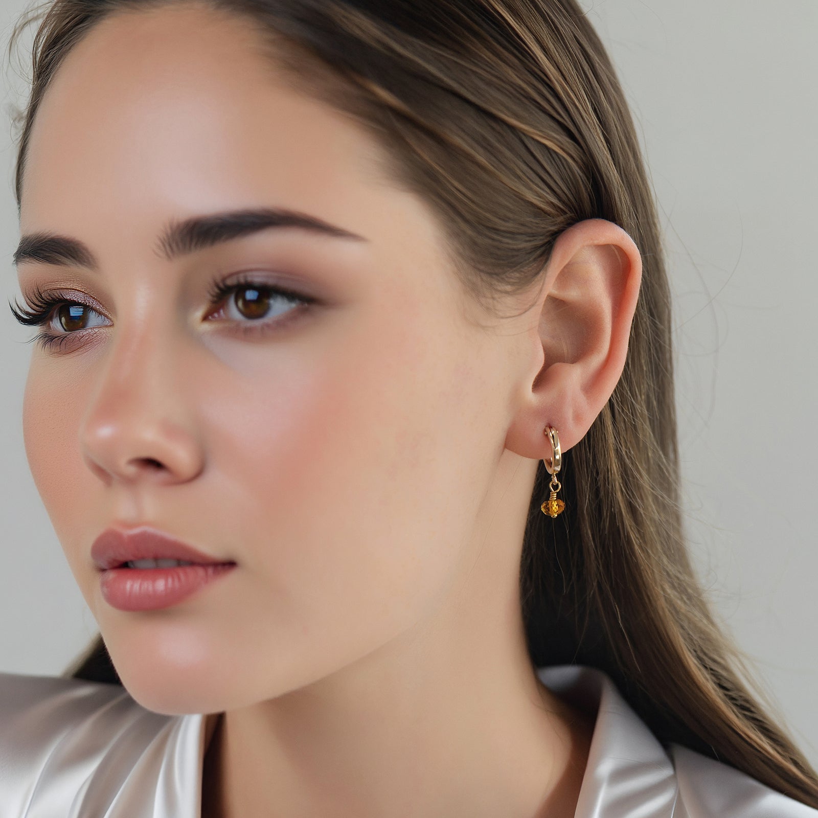 november birthstone earrings on a model 