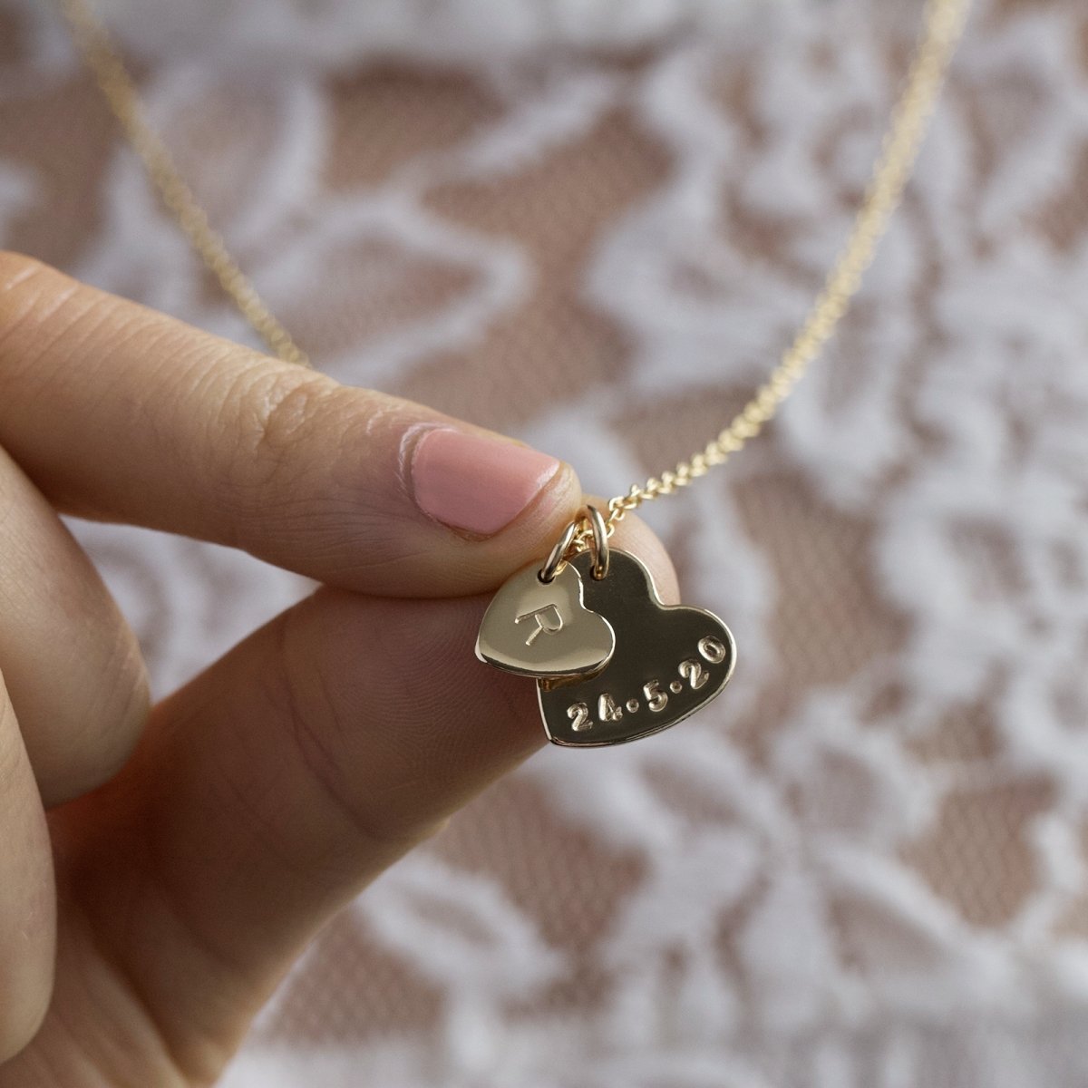 gold double heart necklace with initial and date